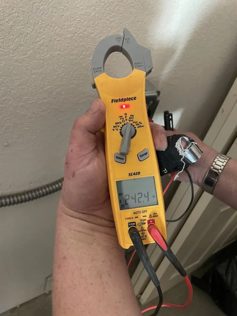 Voltage testing with clamp meter during Outlet Installation in Nashville